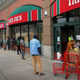 Shoppers waiting in line to get inside a Trader Joe’s in Brookline, Massachusetts